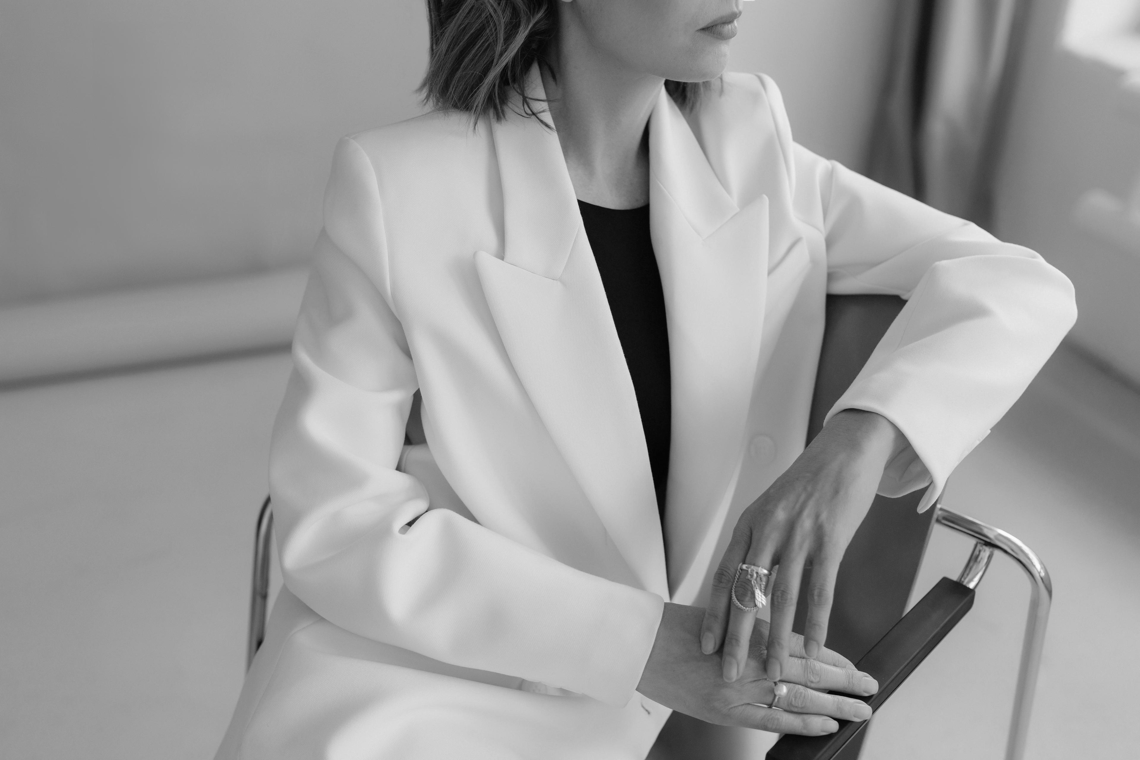 Studio portrait — a model in a white blazer